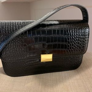 Black leather bag from The Curated.